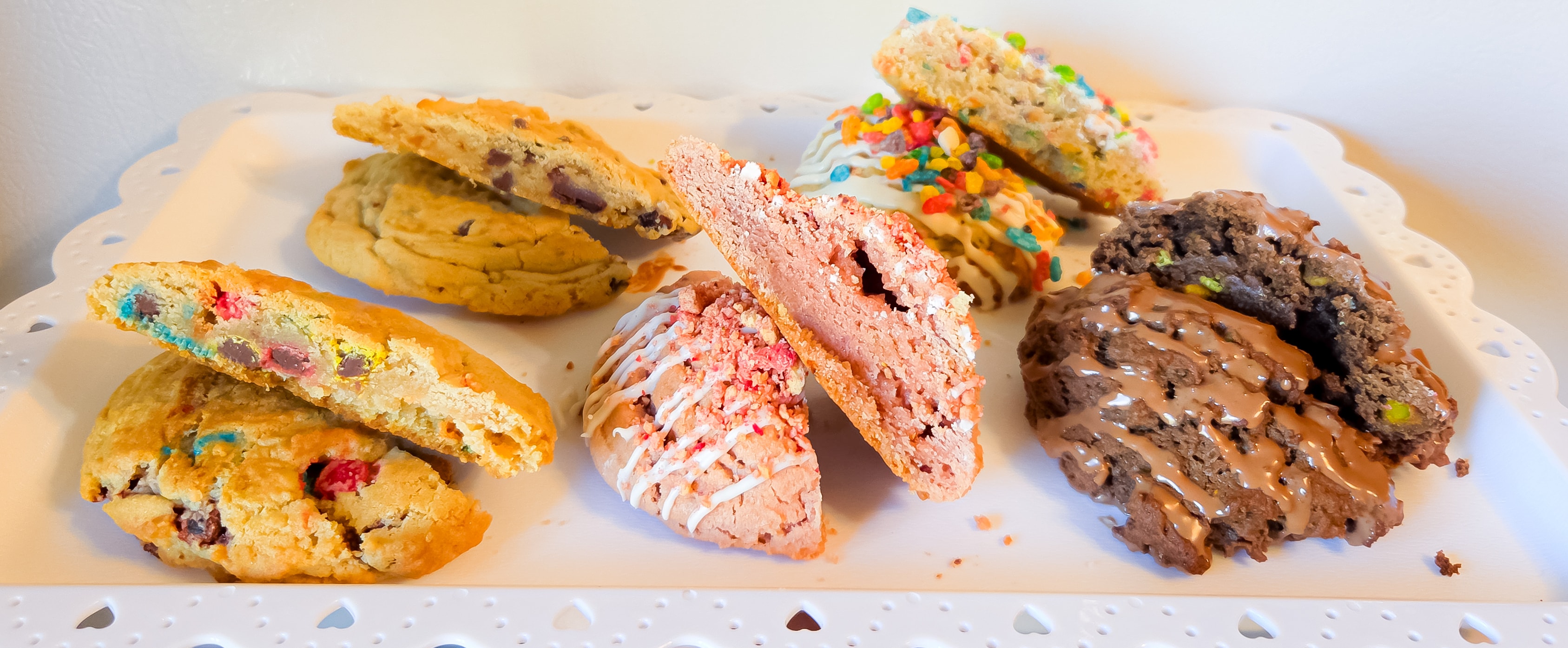 Assorted decorated cookies including chocolate chip, strawberry, and sprinkle varieties